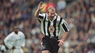 LEEDS, ENGLAND - SEPTEMBER 21: Newcastle United striker Alan Shearer celebrates with his trademark one armed salute after scoring the only goal in a 1-0 FA Premier League victory against Leeds United at Elland Road, on September 21st, 1996 in Leeds, United Kingdom. (Photo by Shaun Botterill/Allsport/Getty Images/Hulton Archive)