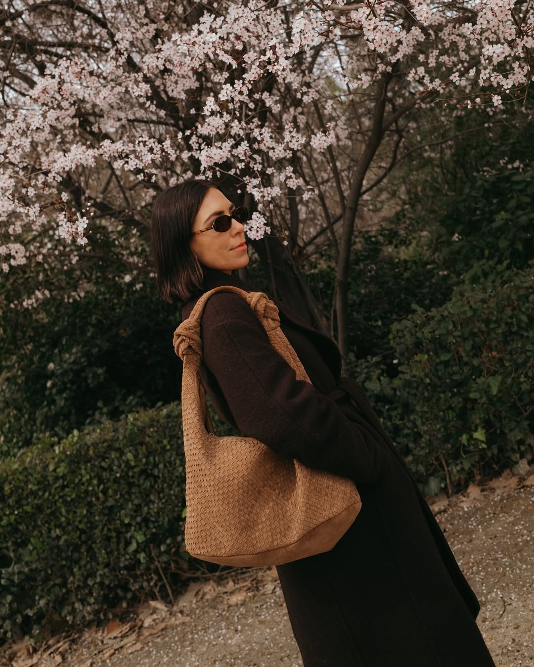 @_jessicaskye wearing a brown coat and bag