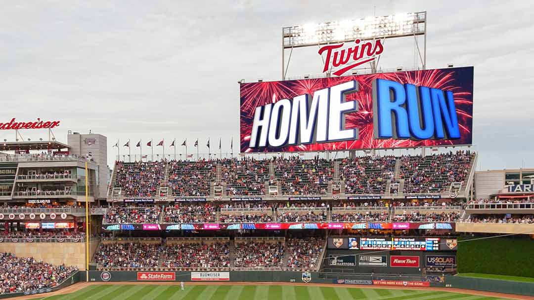 A massive Daktronics LED display says the word Home Run at the Minnesota Twins home ballpark.