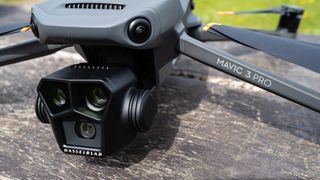A closeup of the three cameras of the DJI Mavic 3 Pro consumer drone