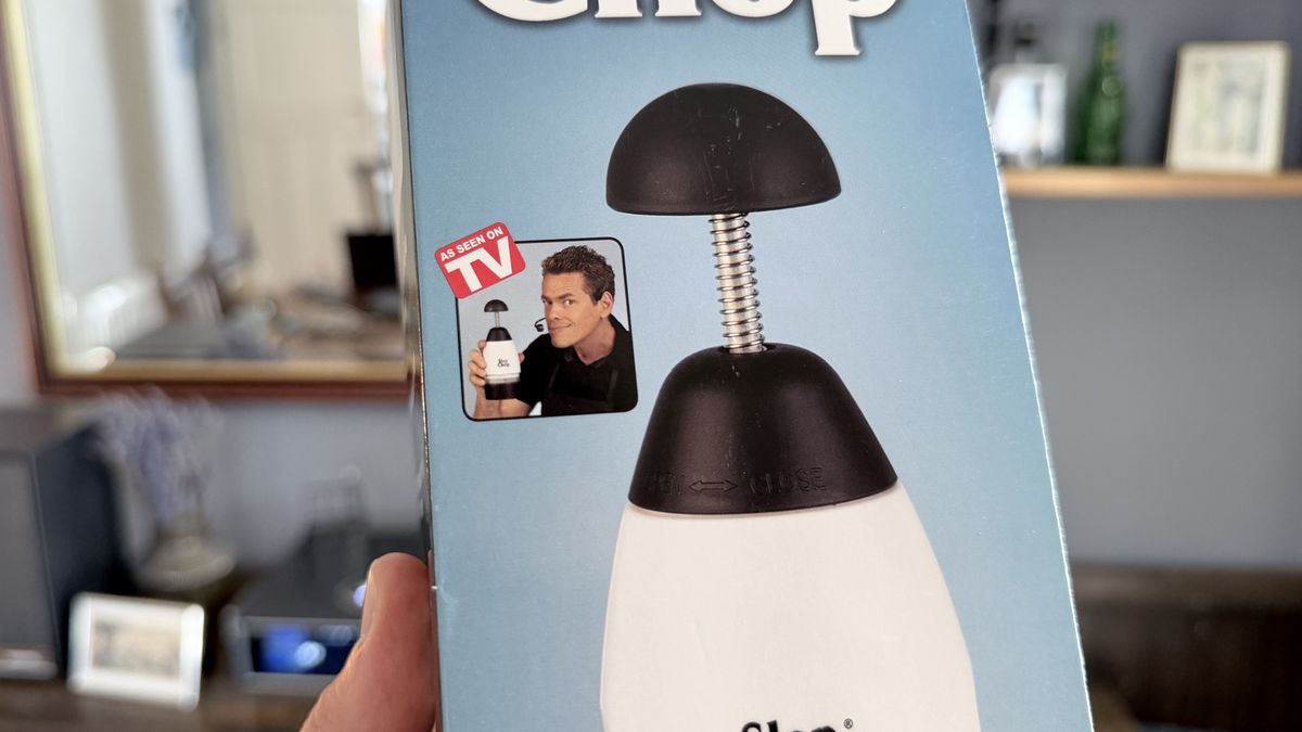 The Slap Chop box in hand showing the 'As Seen On TV' Logo