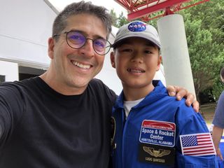 Ernesto Quinteros (left) and his son Lucas, 11, pose for a photo at Space Camp at the U.S. Space & Rocket Center in Huntsville, Alabama where officials launched nearly 5,000 rockets on July 16 to celebrate the 50th anniversary of the Apollo 11 moon mission launch in 1969.