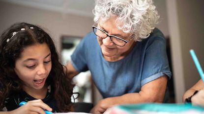 older woman tutoring a child