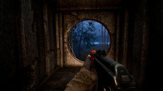 A screenshot showing Stalker 2's protagonist exiting a building through a broken grate