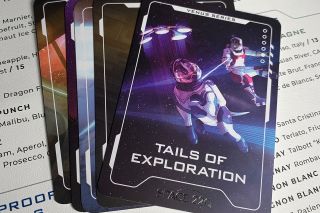 One of the Space 220 trading cards depicts "Tails of Exploration," a space history-inspired scene diners might see.