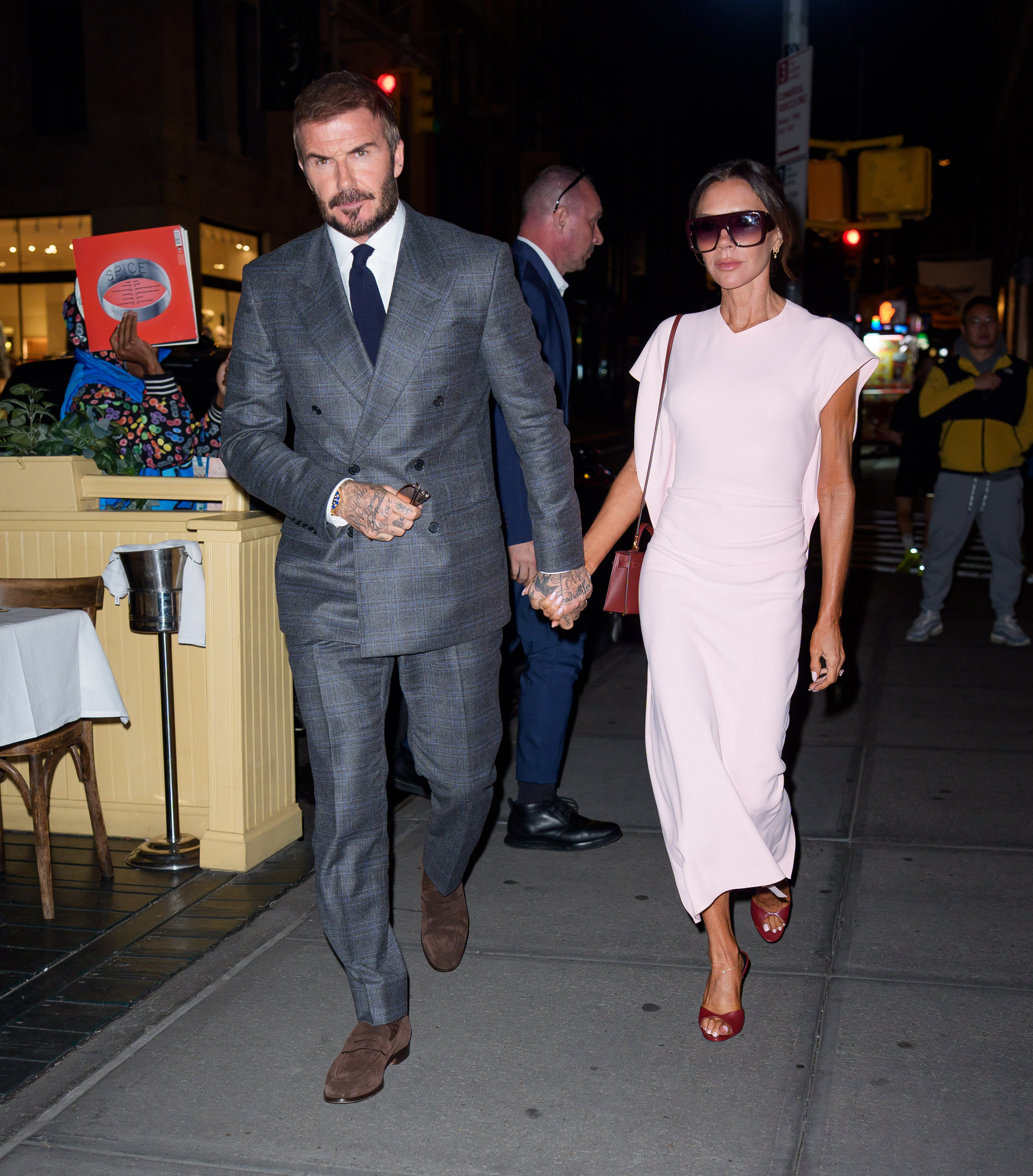 Victoria Beckham wore a peony pink dress with burgundy accessories last October