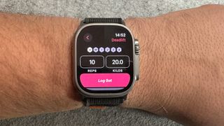 An Apple Watch on a wrist showing the Fitbod app