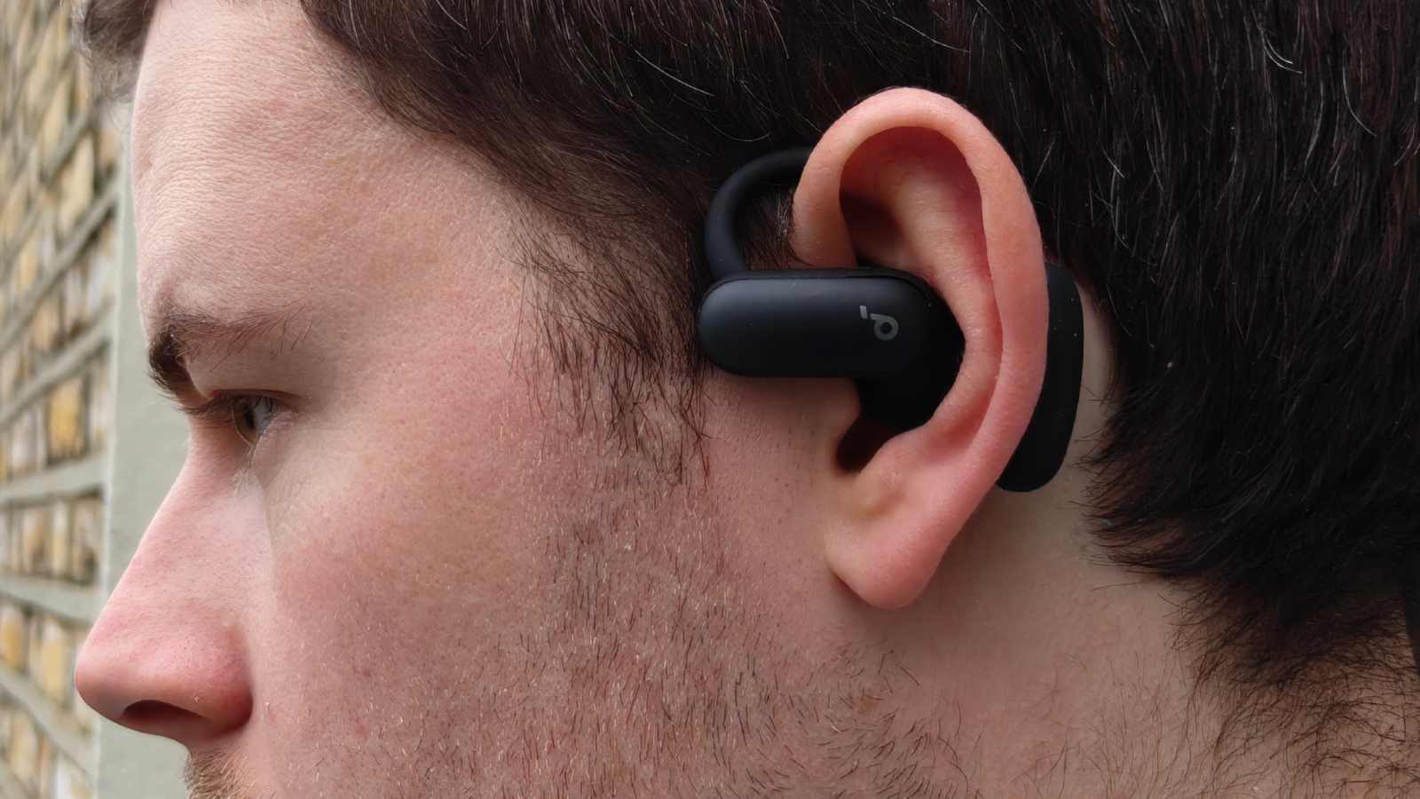 The Soundcore Aerofit 2 Pro in a man's ear, in open mode.