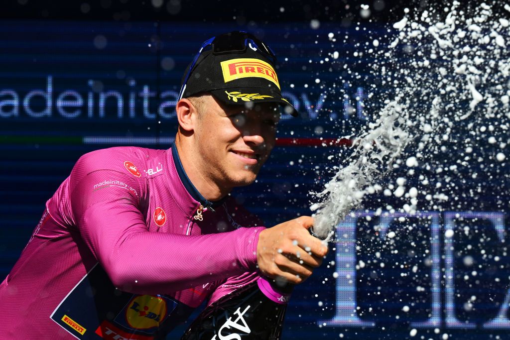 LUCCA ITALY MAY 08 Jonathan Milan of Italy and Team Lidl Trek Purple Points Jersey celebrates at podium during the 107th Giro dItalia 2024 Stage 5 a 178km stage from Genova to Lucca UCIWT on May 08 2024 in Lucca Italy Photo by Tim de WaeleGetty Images