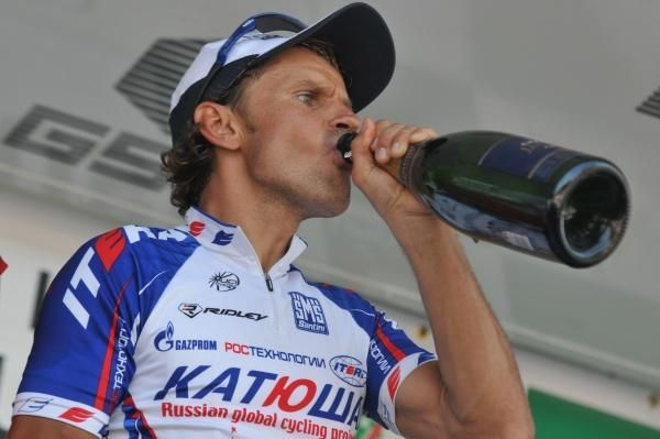 Alexandre Botcharov takes a swig of champagne on the podium.