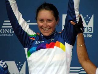 Oenone Wood celebrates her World Cup leader's jersey Photo: © Joel Roberts