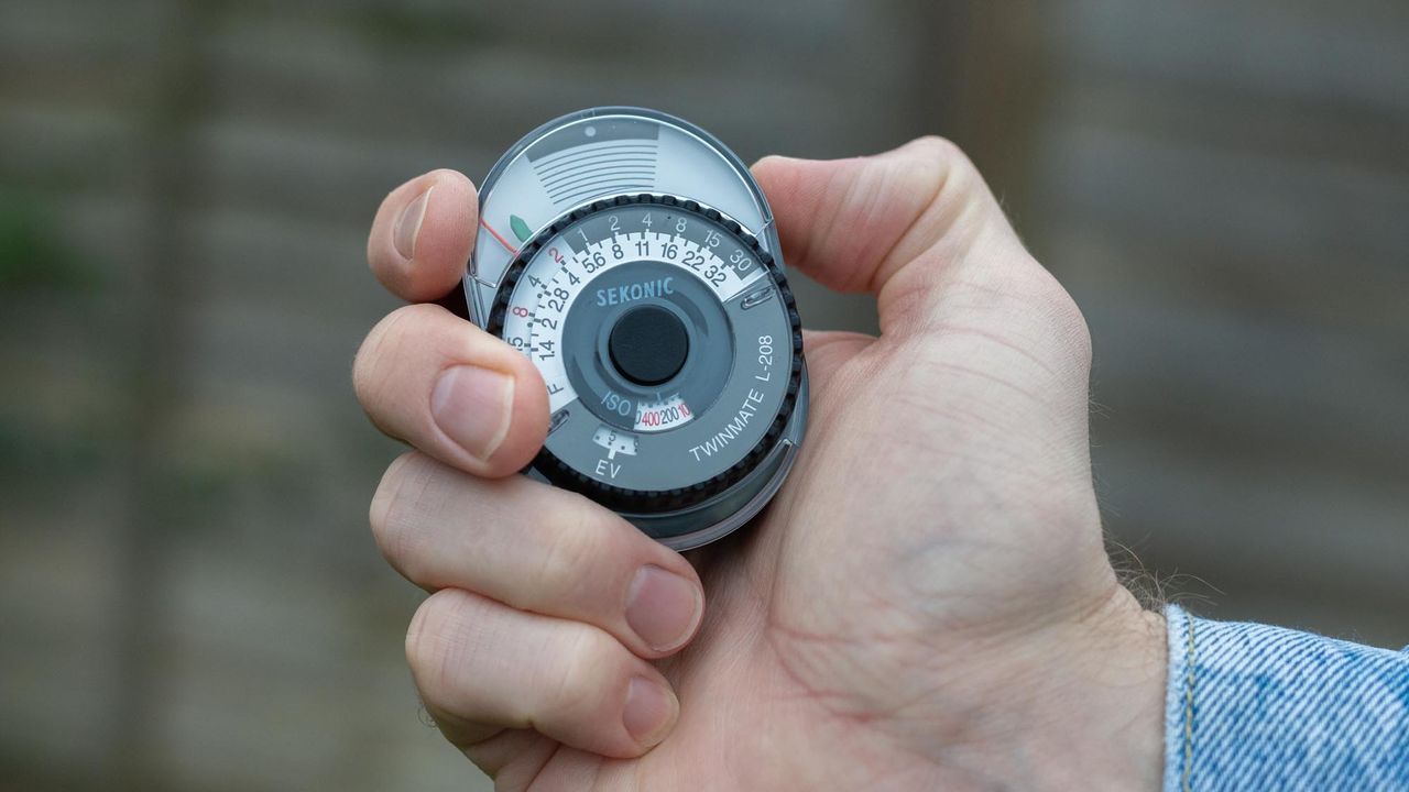 Sekonic Twinmate L-208 being held in palm of hand