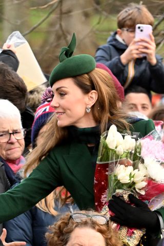 Kate Middleton wears a green coat and hat to meet royal fans outside St Mary Magdalene church in Sandringham on Christmas Day