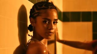 Tyla is shown in her music video for "Water."