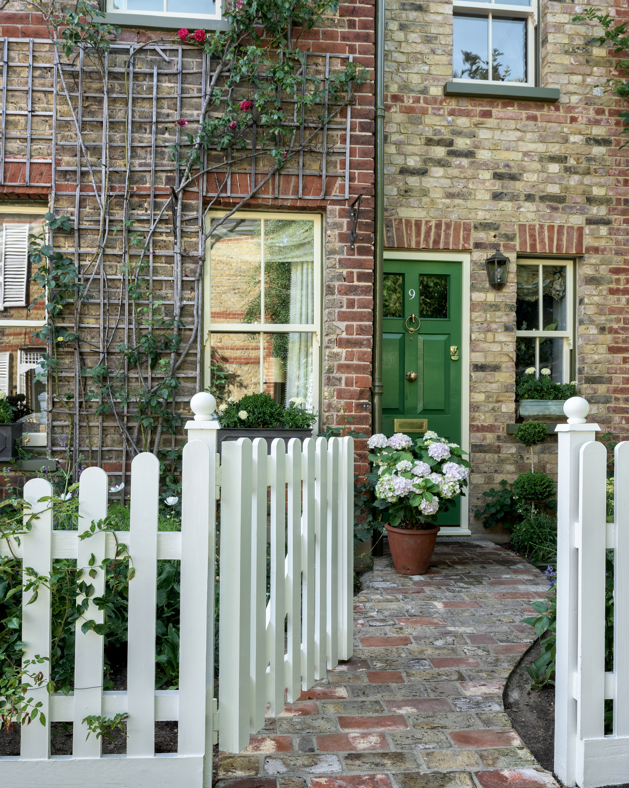 path winding through the front garden of a victorian home to the door