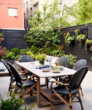 The Manscapers designed backyard in New York with plants and outdoor furniture