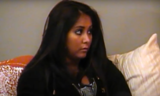 Snooki from Jersey Shore having a serious conversation about the note while sitting on a couch.