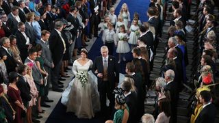 Princess Eugenie walks down the aisle with her father, Prince Andrew