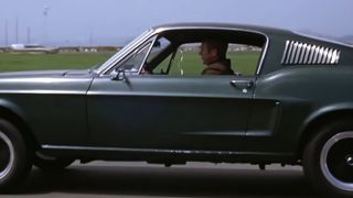 Steve McQueen drives his iconic Ford Mustang in Bullit
