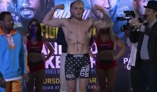 Jake Paul flexing during the weigh-in
