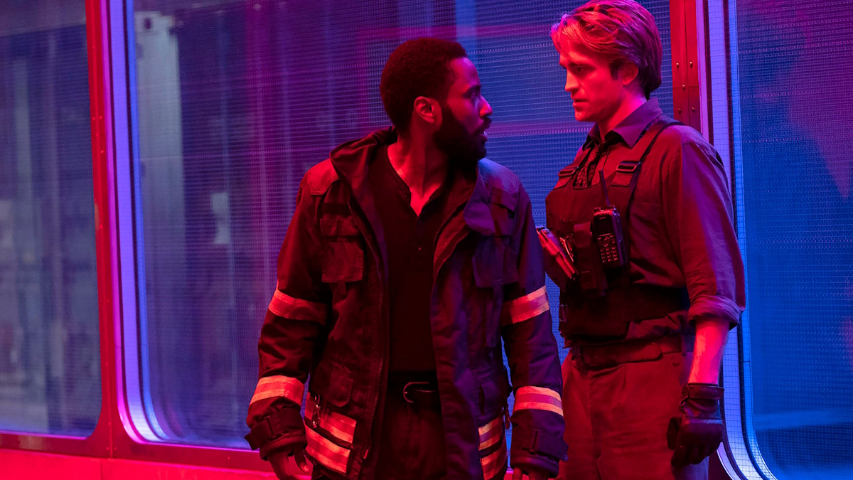 John David Washington and Robert Pattinson stand in a hallway in Tenet