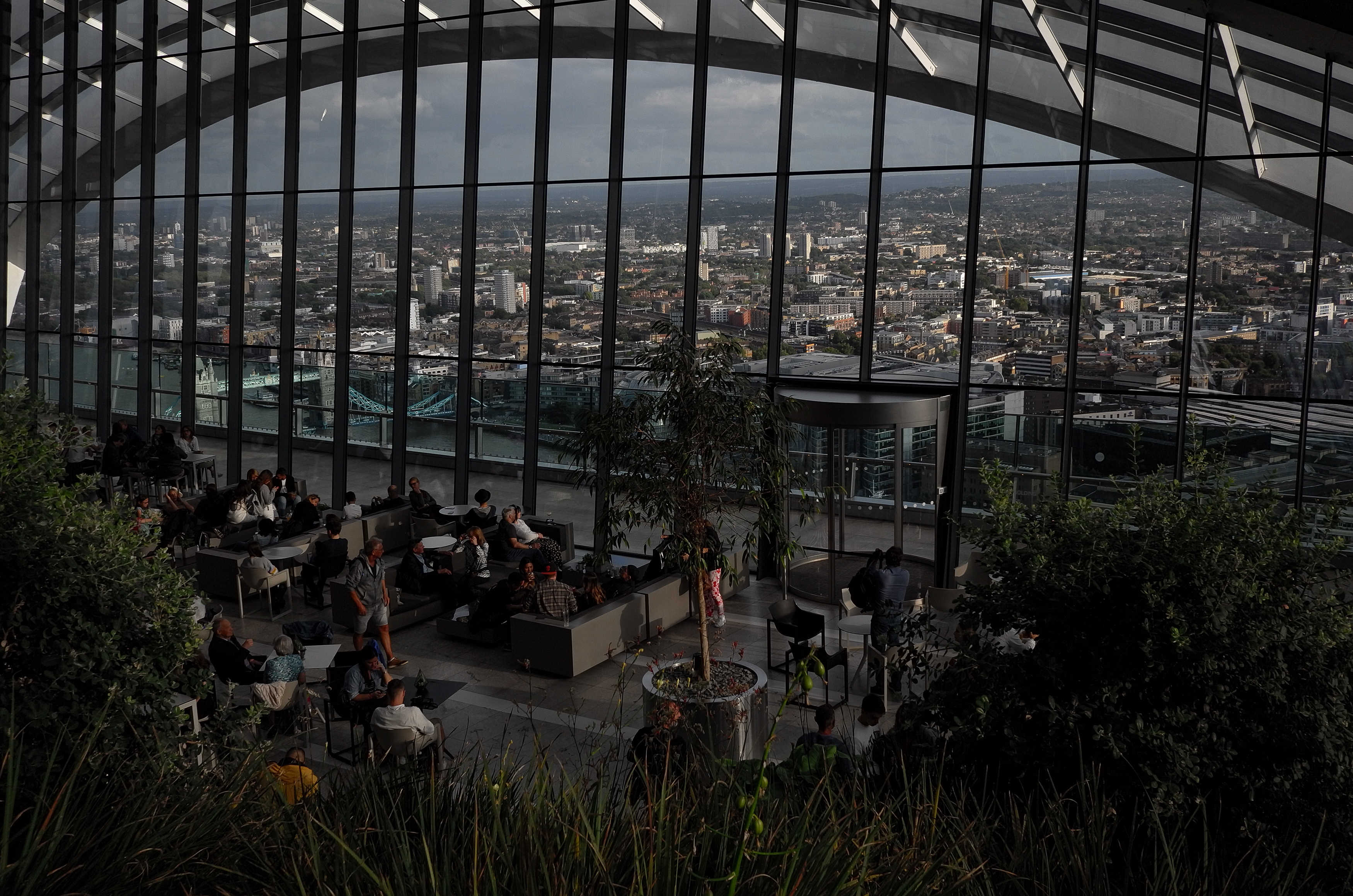 General view from the rooftop of 20 Fenchurch Street skyscraper, named Sky Garden, in London, on August 18, 2019. Number 20 Fenchurch Street in the financial district is London's newest skyscraper and is known as The Walkie Talkie. The Sky Garden sits at the top of the building, with two restaurants and a bar, and is Londons highest public garden.