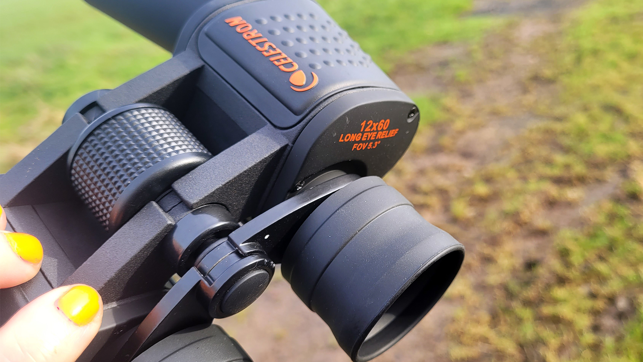 Celestron SkyMaster 12x60 showing the long eye relief and the pimpled rubber coating for extra grip