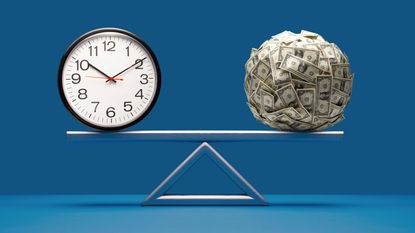 A clock is balanced by a ball of money on a fulcrum.
