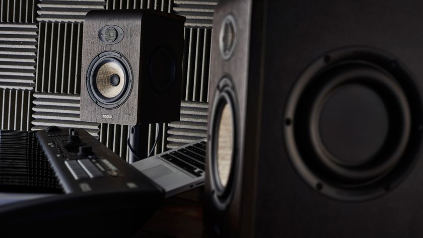 A pair of Focal Shape 65 studio monitors on stands in a studio
