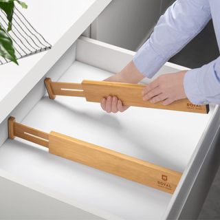 Bamboo drawer dividers being fitted into a drawer