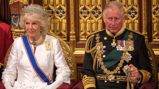 King Charles and Queen Camilla sit during State Opening of Parliament