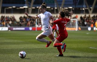 England’s Lucy Bronze (left) and Canada’s Allysha Chapman battle for the ball