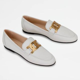 white loafers with metal buckles