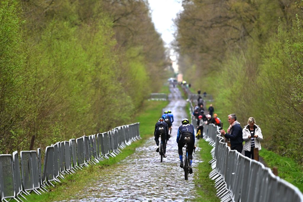 ROUBAIX FRANCE APRIL 05 Johan Jacobs of Switzerland and Movistar Team with teammates train at the Troue dArenberg cobblestones sector during the 121st ParisRoubaix 2024 Previews UCIWT on April 05 2024 in Roubaix France Photo by Luc ClaessenGetty Images