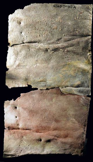 The lead curse tablet is very thin and could have been folded up. This side contains a short summary of what the inscription says and would have gone on the outside.