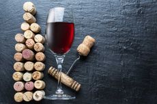 Wine corks in the shape of wine bottle on the graphite background