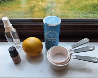 Ingredients needed for a room spray with lemon, ginger and orange.