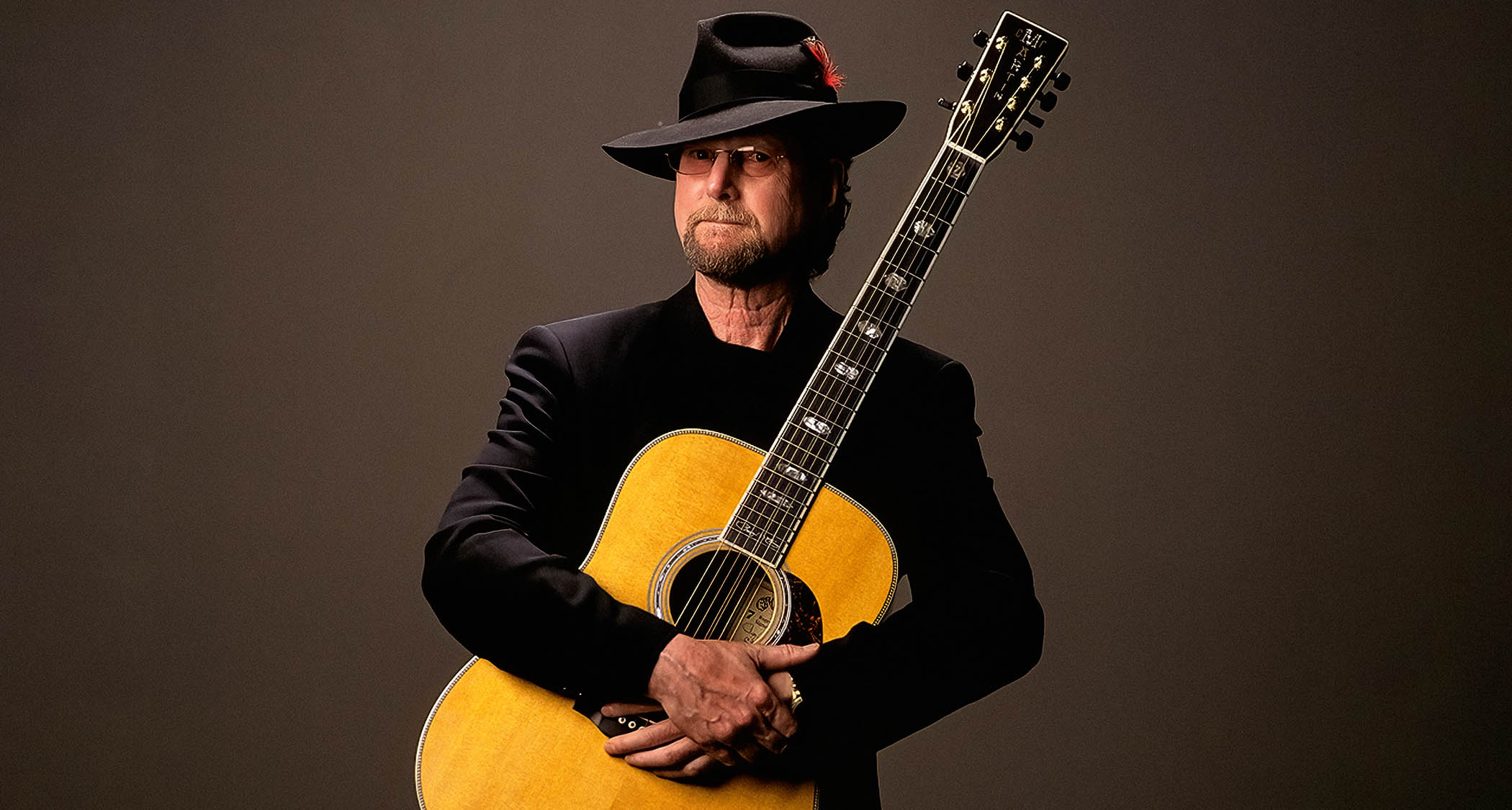 Roger McGuinn poses with his signature Martin 7-string acoustic