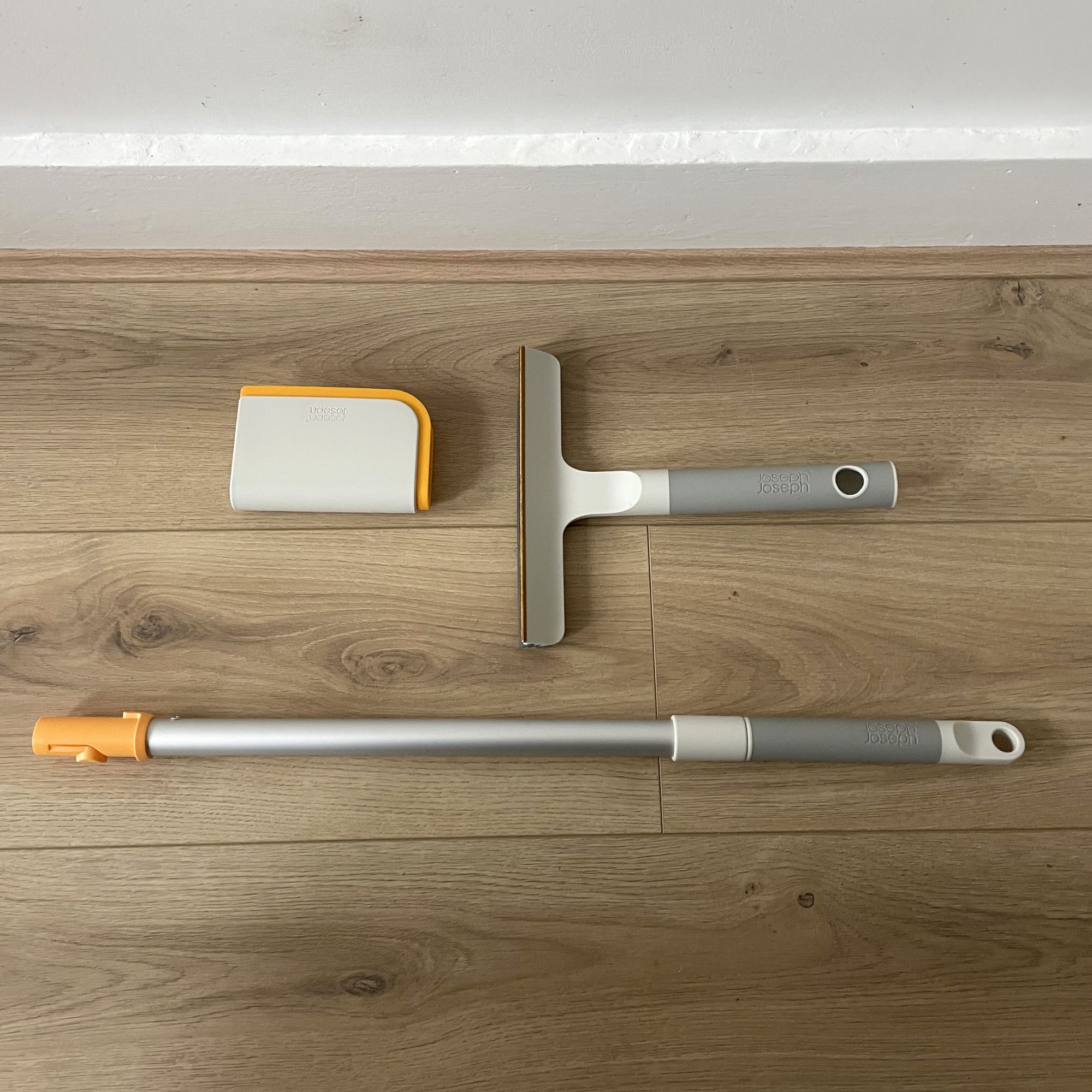Joseph Joseph pet hair cleaning tools on wood-effect flooring