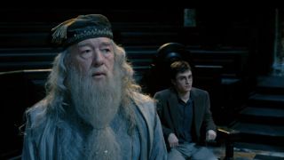 Dumbledore standing in front of a seated Harry Potter