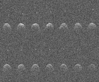 grainy image showing 14 blurry radar images of Didymos and its moonlet Dimorphos.