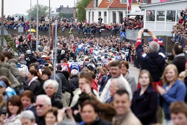 The peloton weaves its way through a sea of spectators in the Netherlands