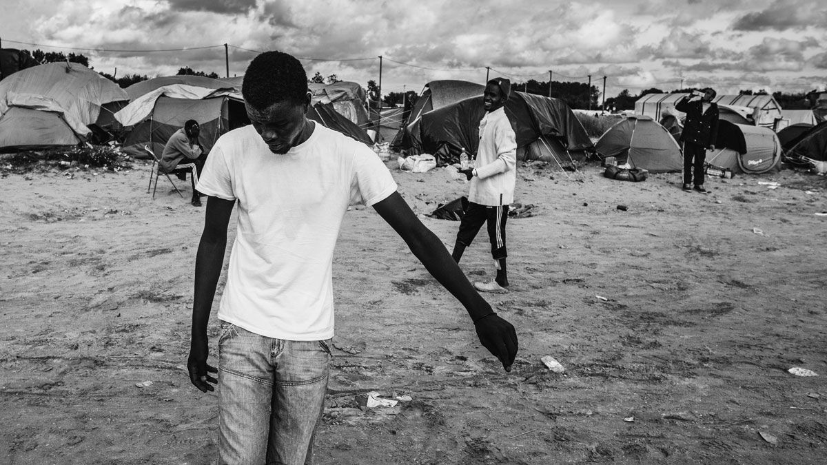 A group of migrants playing football in the camp