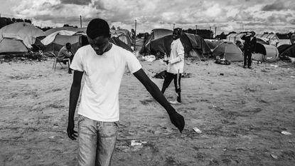 A group of migrants playing football in the camp