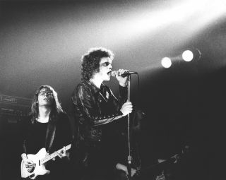 Lou Reed performs onstage with (left) Steve Hunter at the Concertgebouw in Amsterdam in September 1973