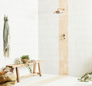 A shower with basket weaved subway tiles