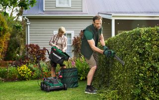 man and woman gardening