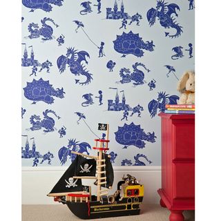 kids bedroom with seahorse wallpaper and soft toy