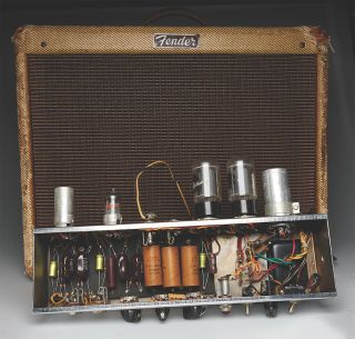 A vintage Fender Deluxe amp in a tweed finish