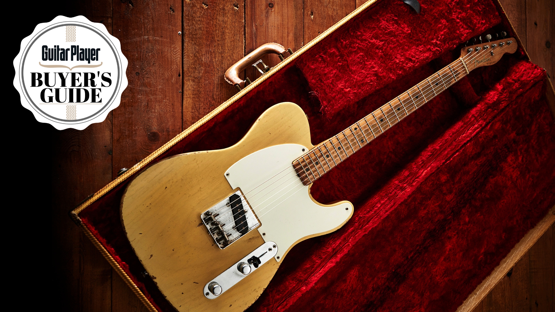A Telecaster electric guitar in a guitar case on a wooden floor